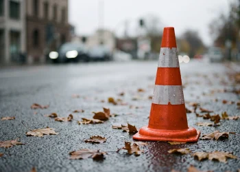 A conceptual image of a traffic cone on an urban road.