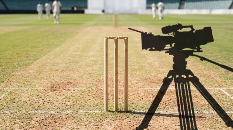 Conceptual image of a cricket wicket and a cinema camera shadow