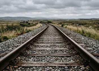 A view of empty railway tracks stretching into the distance.