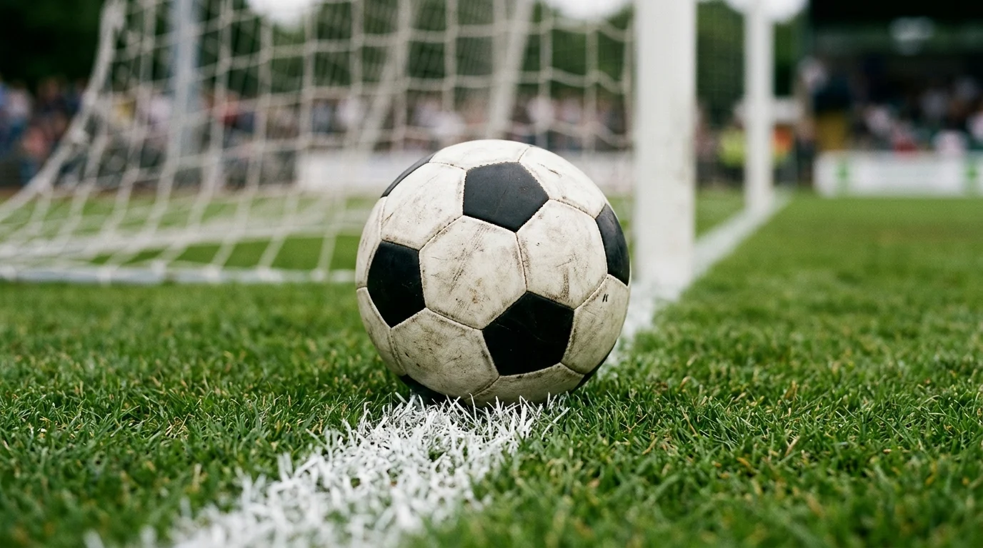 A football on a pitch line.