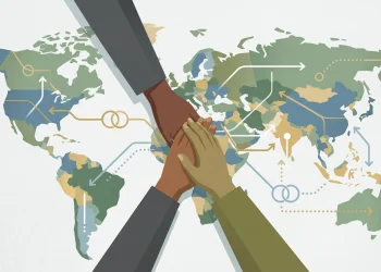 Conceptual image of a humanitarian handshake over a map.