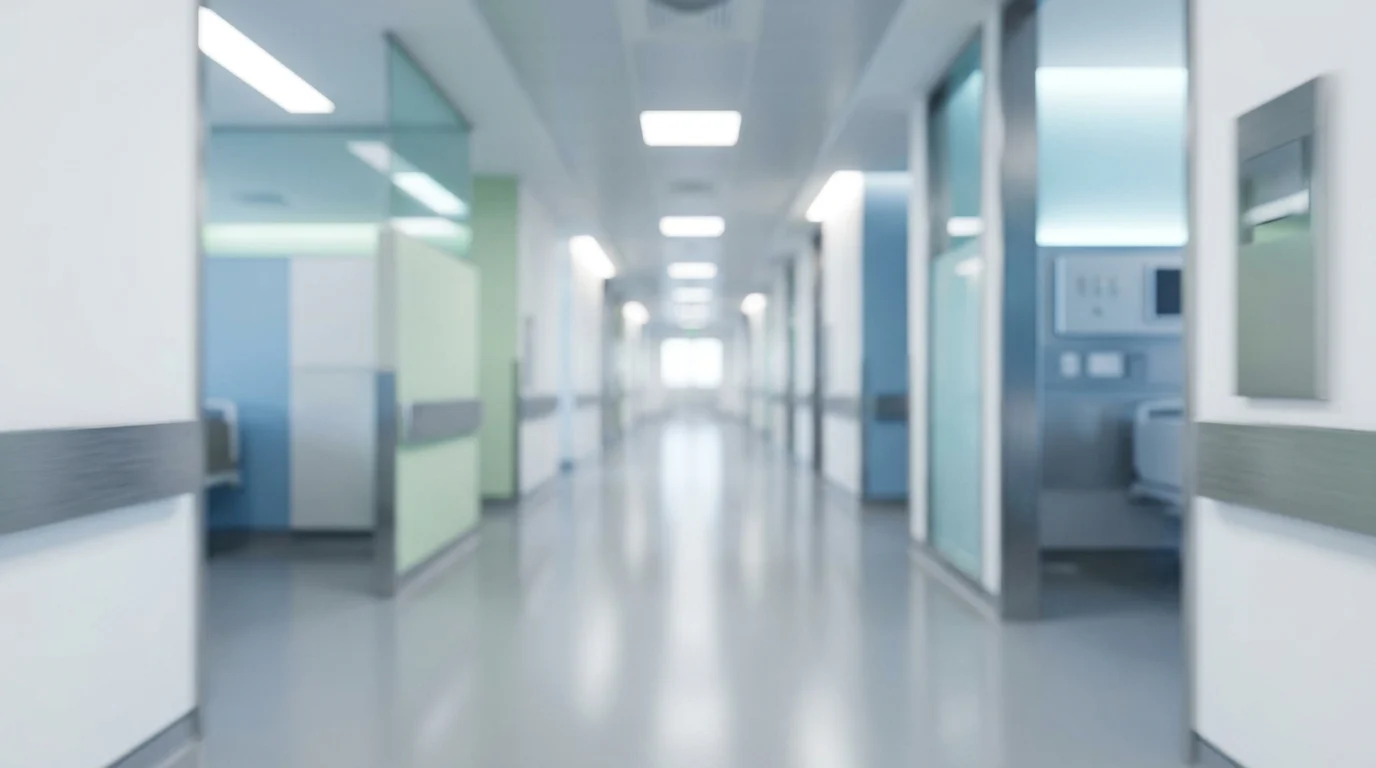 A blurred view of a modern clinical hospital corridor.