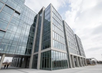 A conceptual image of a modern glass-fronted office building representing the government's regional headquarters.