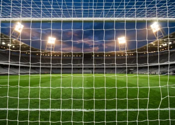 A football net under stadium lights.